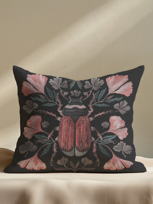 Elegant black pillowcase featuring detailed coral-red beetle illustration centered amid symmetrical pink flowers and gray-green foliage. The dark background enhances the intricate entomology artwork with fine detailing throughout the botanical and insect elements.